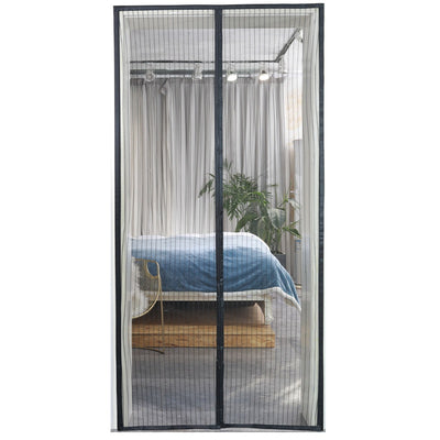 Black magnetic mosquito-proof curtain installed in a white doorway, with a puppy sitting in front of it. - Image 4