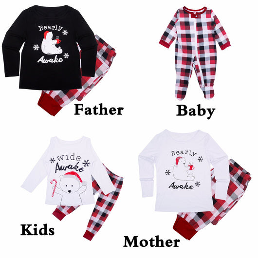 Mother and child in matching red, black, and white plaid Christmas pajamas, child wearing a Santa hat. - Image 9
