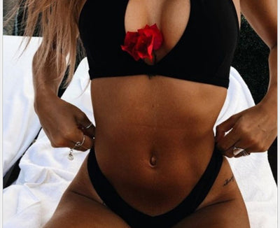Black two-piece bikini with a high-neck halter top featuring a deep V-neck and matching classic bikini bottoms. - Image 4