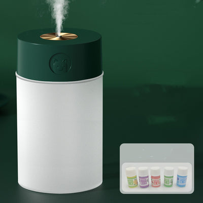 White cylindrical humidifier with a gold nozzle emitting mist, featuring a subtle bear emblem. Includes five aromatherapy oil bottles. - Image 9