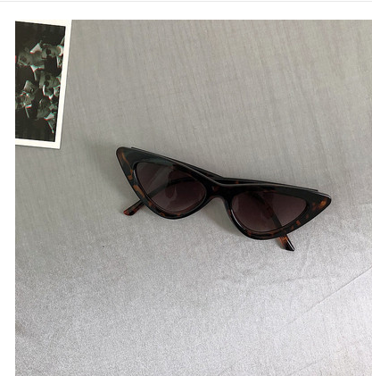 Retro cat-eye sunglasses with a tortoiseshell frame and dark lenses, ideal for a stylish, vintage look. - Image 22