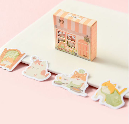 Set of 45 cute penguin paper stickers with various expressions and poses, packaged in a decorative shop-front box. - Image 2
