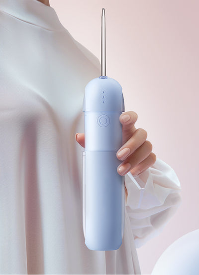 White portable electric dental water flosser with a clear nozzle and retractable water tank for oral hygiene. - Image 23