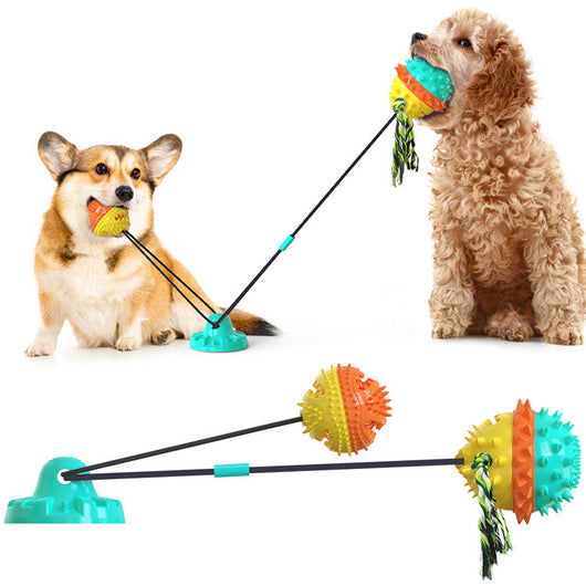 Red, white, and blue textured dog chew toy with rope tassels and a blue suction cup base, shown with a Dalmatian puppy playing. - Image 23