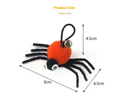Orange and black plush spider cat toy with googly eyes and a silver bell on a white background. - Image 7