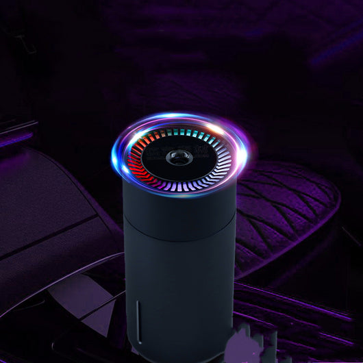 Black cylindrical vehicular humidifier with a silver trim and a vertical indicator light on a white background. - Image 10