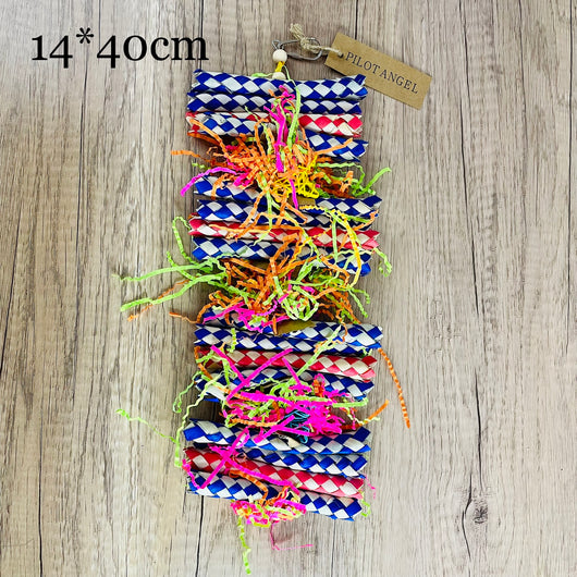 Colorful parrot toy with woven blue, white, and red paper strips, filled with bright crinkly paper, on a wooden background. - Image 4