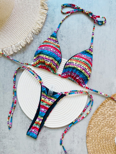 Women's multicolor letter printed lace-up bikini suit with triangle top and thong bottom, displayed on a white mat. - Image 6