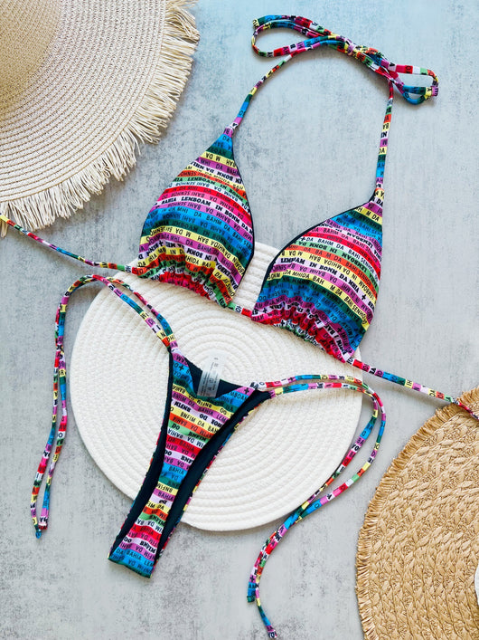 Women's multicolor letter printed lace-up bikini suit with triangle top and thong bottom, displayed on a white mat. - Image 6