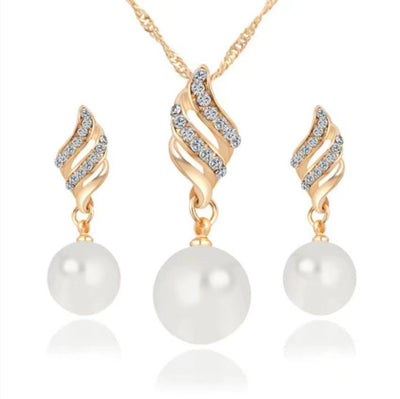 Gold-tone necklace and dangle earring set with faux pearls and clear rhinestones, displayed on a black bust. - Image 5