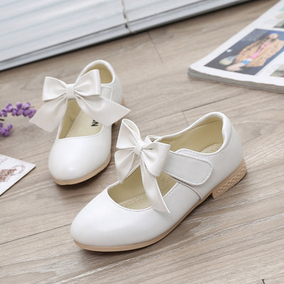 Gold Mary Jane shoes for girls with a large decorative bow on the strap and a low, comfortable heel. - Image 5