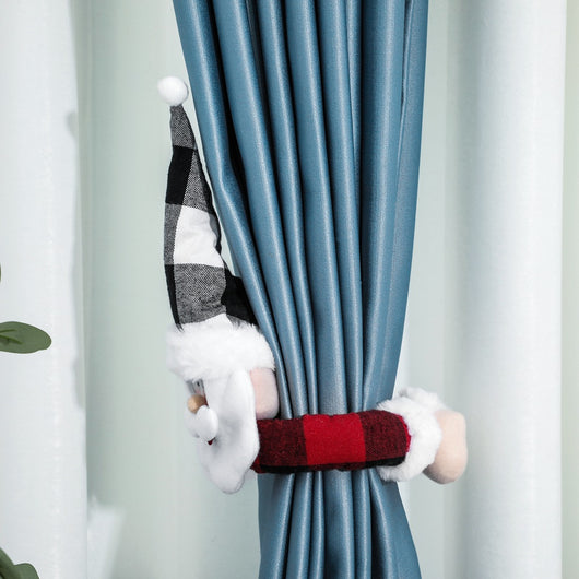 Santa Claus curtain buckle with a black and white buffalo plaid hat, white beard, and red body holding a blue curtain. - Image 2