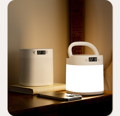 White rechargeable LED table lamp with a digital clock display and a light gray carrying handle. - Image 15