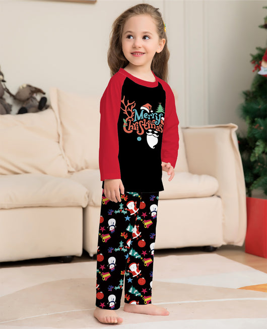 Man wearing a black and red long-sleeve Christmas pajama set with "Merry Christmas" graphic and Santa print pants. - Image 3