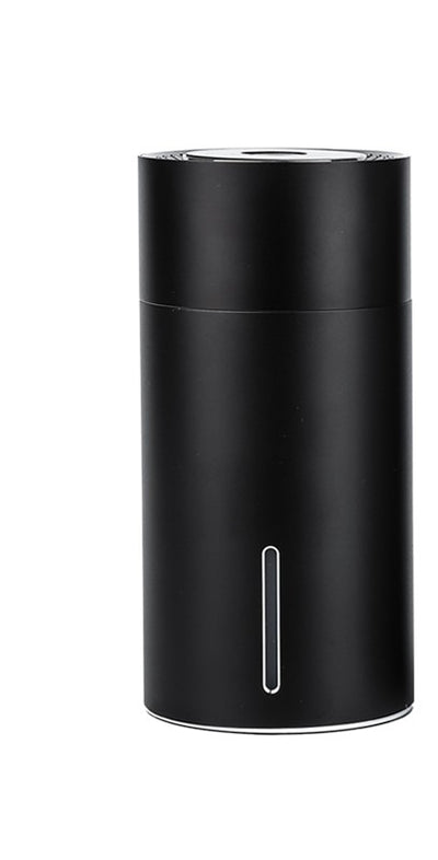 Black cylindrical vehicular humidifier with a silver trim and a vertical indicator light on a white background. - Image 9