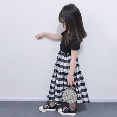 Matching black and white gingham two-piece outfits, one adult and one child size, with black short-sleeve tops and tiered skirts. - Image 4