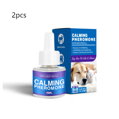 Cat Calming Pheromone Diffuser Kit with a white plug-in diffuser and a green refill bottle, next to its green and white box. - Image 26