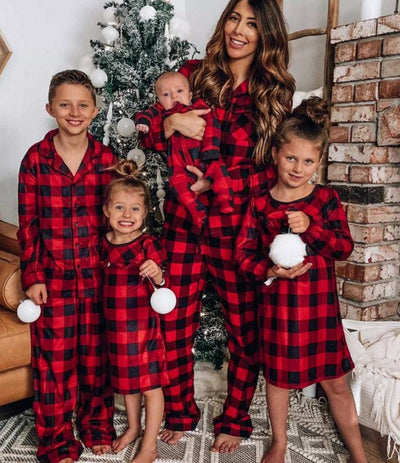 Baby in a red and black buffalo plaid long-sleeve pajama romper, viewed from the back with arms raised. - Image 32