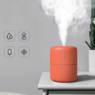 Coral desktop humidifier with a modern cylindrical design, featuring a green indicator light and a power button. - Image 11