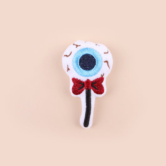 Plush cat teaser shaped like an eyeball lollipop with a blue iris, black pupil, and red bow. - Image 4