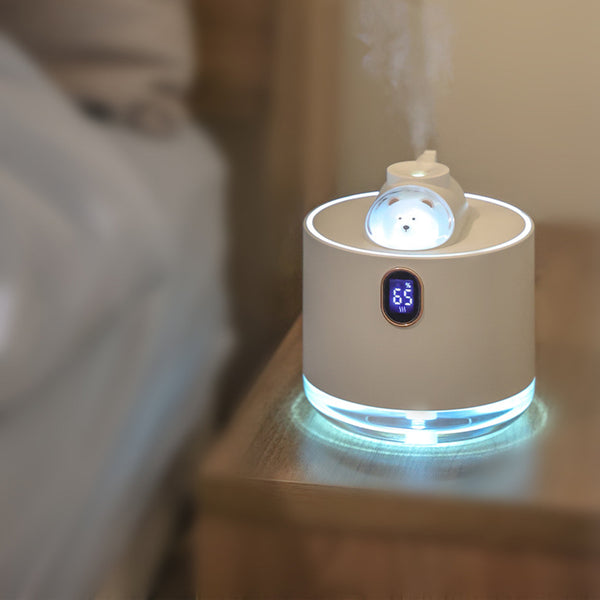 Pink wireless air humidifier with a cute white cat head design, digital display, and transparent water tank.