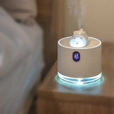 Pink wireless air humidifier with a cute white cat head design, digital display, and transparent water tank.