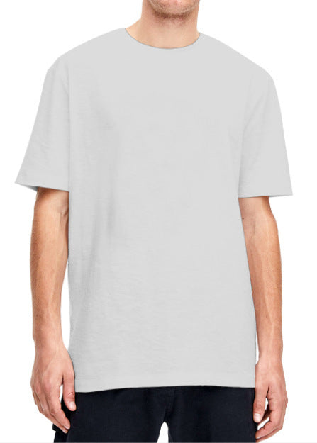 Plain light beige short-sleeved crew neck t-shirt made of cotton, shown on a model. - Image 25