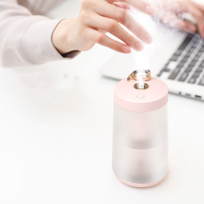 Cute cat-themed USB desktop humidifier with a pink top and base, frosted clear body, and gold cat ear accent. - Image 14