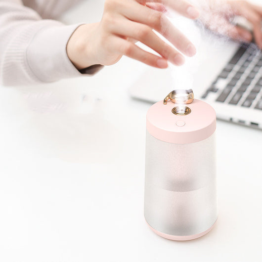 Cute cat-themed USB desktop humidifier with a pink top and base, frosted clear body, and gold cat ear accent. - Image 14