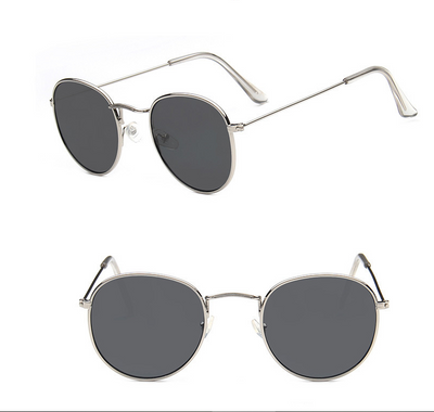 Two pairs of round gold-frame sunglasses, one with mirrored orange lenses and one with solid red lenses. - Image 10