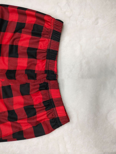 Matching family Christmas pajamas with white long-sleeve tops featuring a red plaid reindeer and red and black buffalo plaid pants. - Image 4