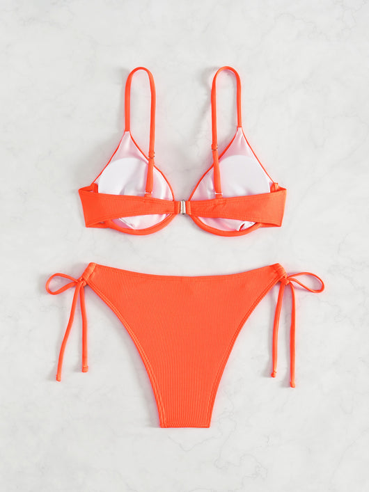 Black ribbed two-piece bikini with an underwire top and tie-side bottoms on a white marble surface. - Image 34