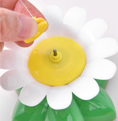 Automatic cat teaser toy with an electric rotating bird on a steel wire, attached to a green and white flower base. - Image 12
