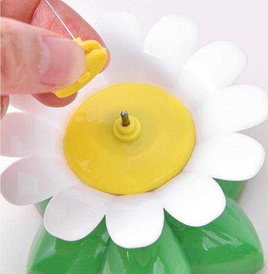 Automatic cat teaser toy with an electric rotating bird on a steel wire, attached to a green and white flower base. - Image 12