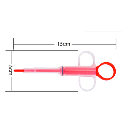 Pet feeding kit with a green syringe-style feeder and two clear teats, packaged for dogs and cats. - Image 11