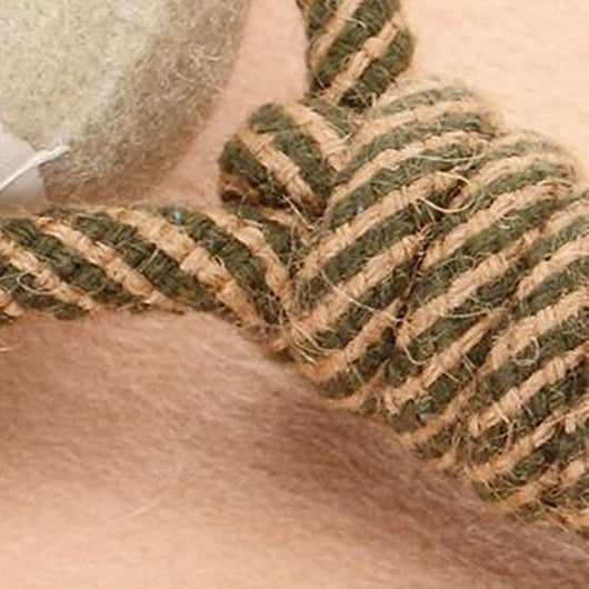 Braided rope dog chew toy with two tennis balls featuring paw prints, shown with a dog holding a similar toy. - Image 9