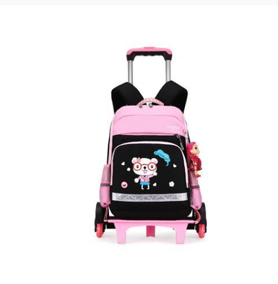 Pink and black detachable trolley backpack for elementary school students with a cartoon bear graphic and doll charm. - Image 11