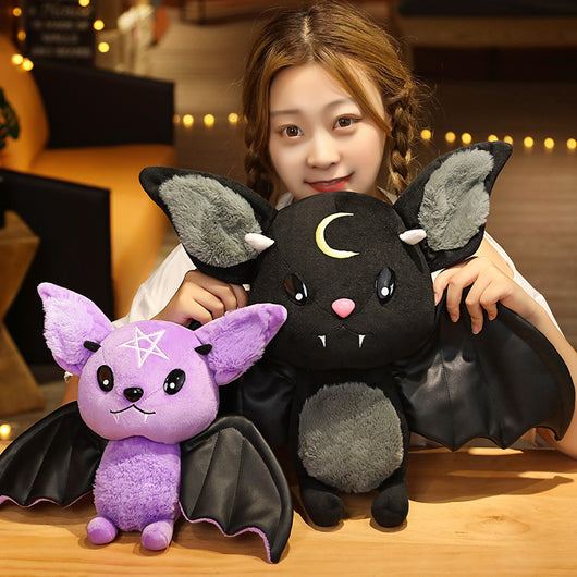 Black bat plush toy with grey ears and belly, pink nose, white fangs, and a yellow crescent moon. - Image 7