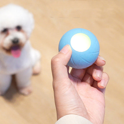 Orange smart rolling ball cat toy with a glowing blue-green light, designed for interactive play and boredom relief. - Image 8