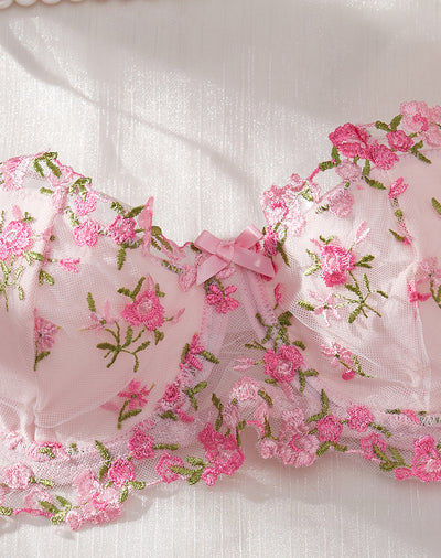 Pink floral embroidered lace lingerie set with bra, garter belt, and thong on a white textured background. - Image 12