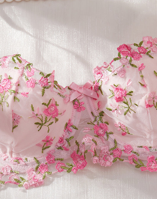 Pink floral embroidered lace lingerie set with bra, garter belt, and thong on a white textured background. - Image 12