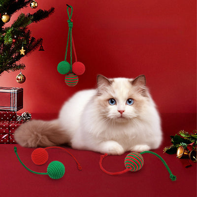 Red and green striped cotton rope ball cat toy with two rope tails, ideal for Christmas interactive play.