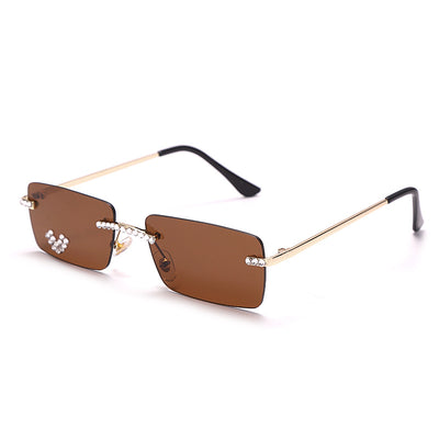 Frameless rectangular sunglasses with pink gradient lenses, gold-tone metal arms, and rhinestone embellishments. - Image 13