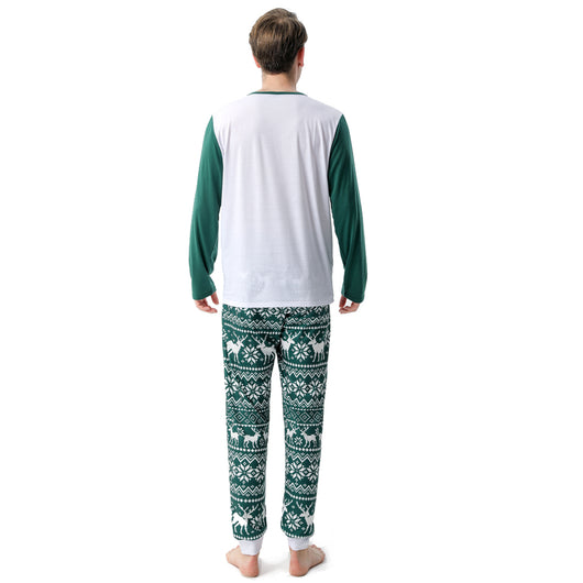 Woman in a Christmas pajama set with a white top, green sleeves, dinosaur graphic, and green fair isle pants. - Image 33
