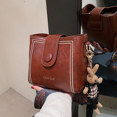 Bolsa Mensajera Retro con Textura Premium