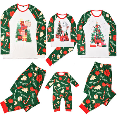 Green baby Christmas pajama romper with red trim, featuring candy canes, ornaments, gingerbread men, and poinsettias.