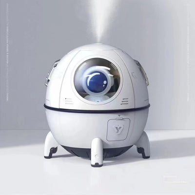 White USB astronaut humidifier shaped like a rocket, emitting mist, with a small astronaut figure inside a clear dome. - Image 7