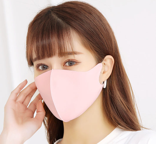 Woman wearing a light gray ice silk face mask with ear loops, suitable for summer and spring. - Image 4