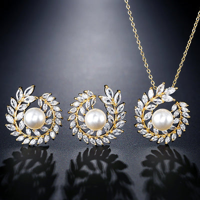 Elegant pearl and cubic zirconia jewelry set with a necklace and two earrings, featuring a wreath design. - Image 3