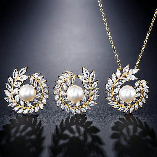 Elegant pearl and cubic zirconia jewelry set with a necklace and two earrings, featuring a wreath design. - Image 3